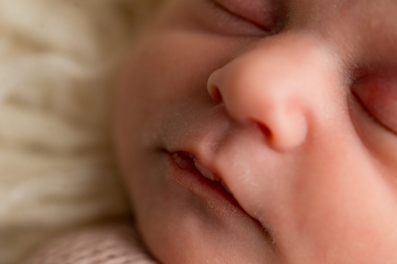 Close up details of newborn baby girls face