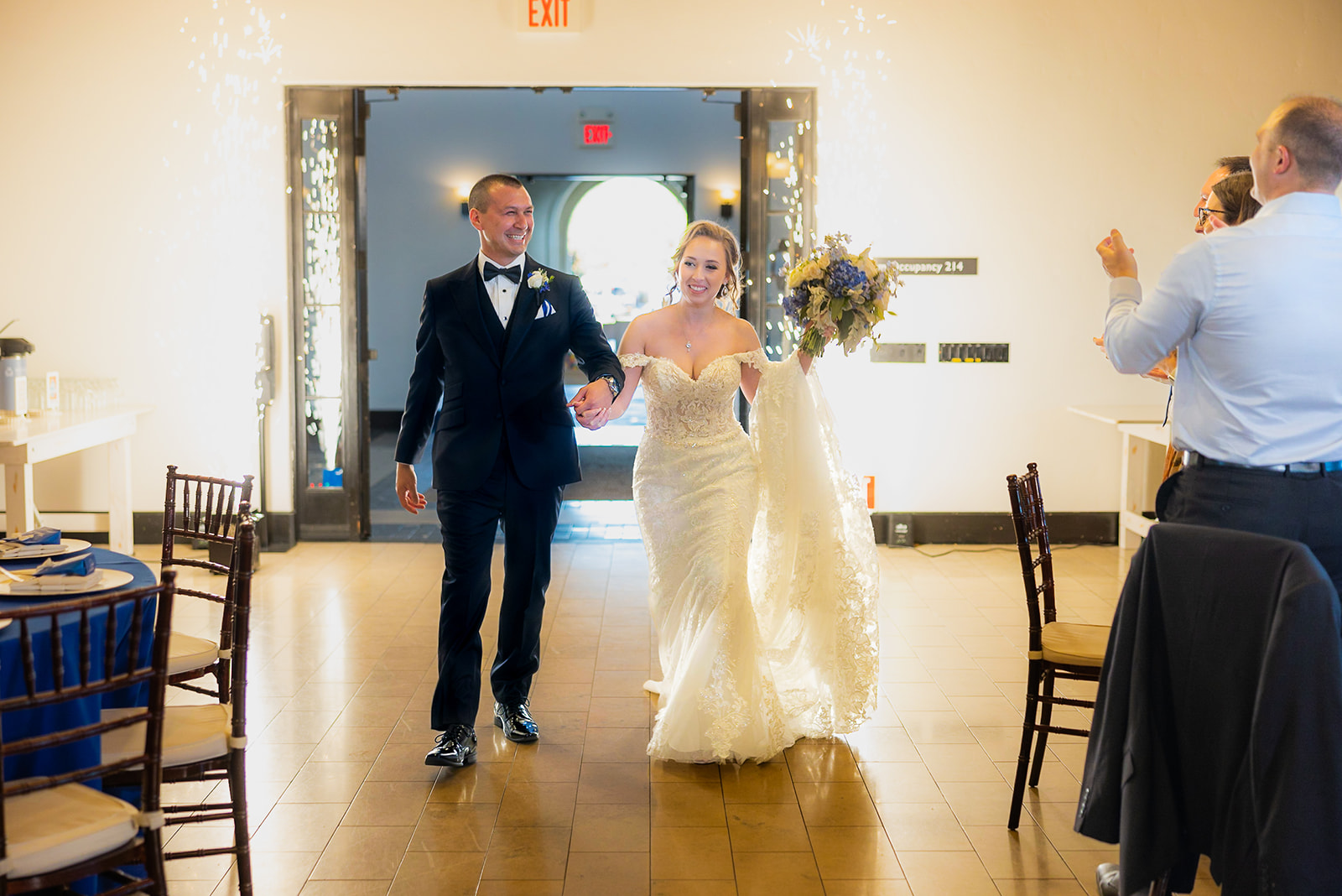 a couple entering their reception at the ranch at silver creek without a first look