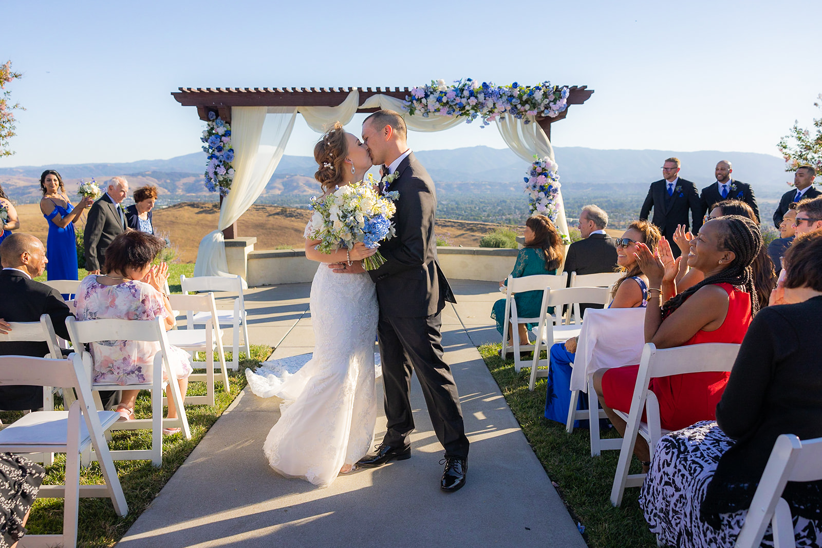 a couple kissing at the alter at The Ranch at Silver Creek by Wedgewood Weddings without a first look