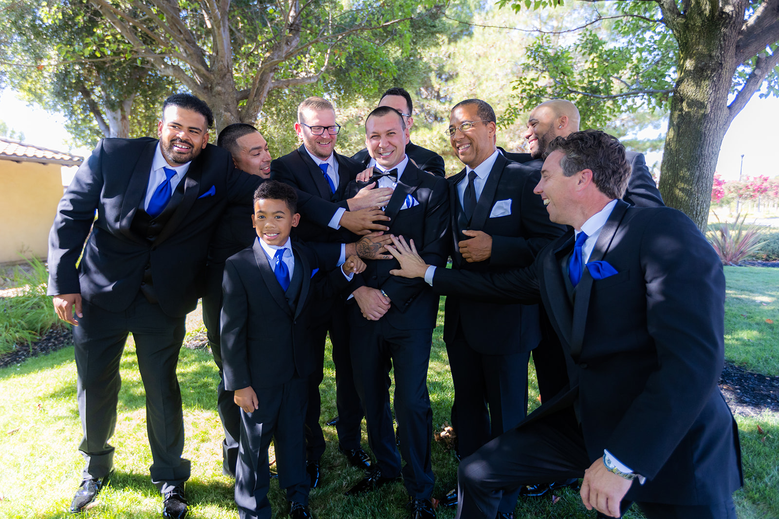 a groom with his groomsmen being funny without a first look