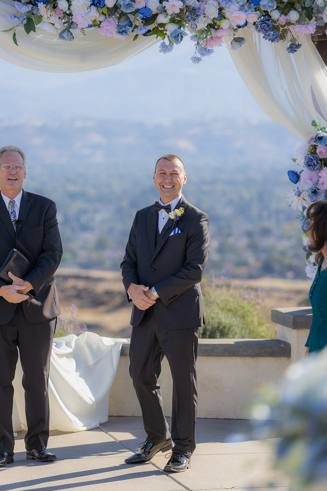 a groom standing at the alter seeing his bride for the first time without a first look at The Ranch at Silver Creek