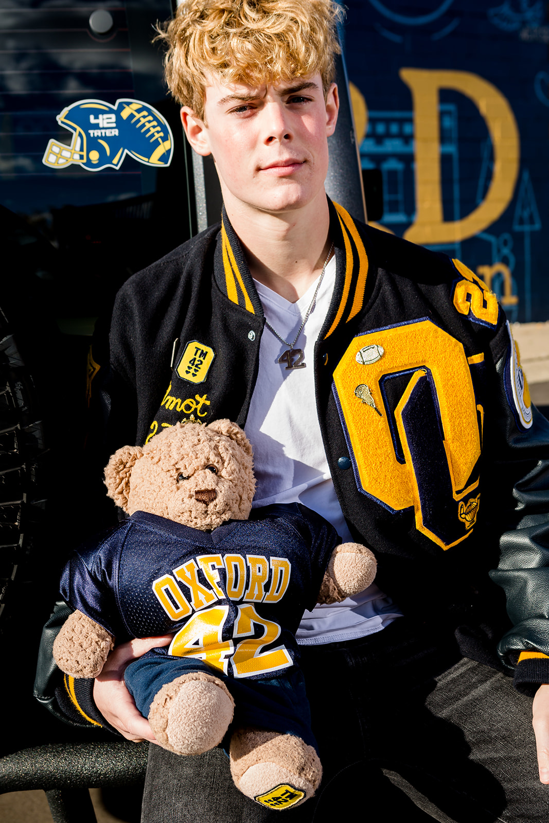 Logan with his bear in commemoration of his friend Tate