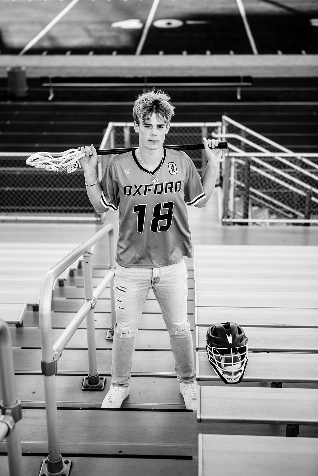 Logan posing with his lacrosse attire at the Oxford stadium