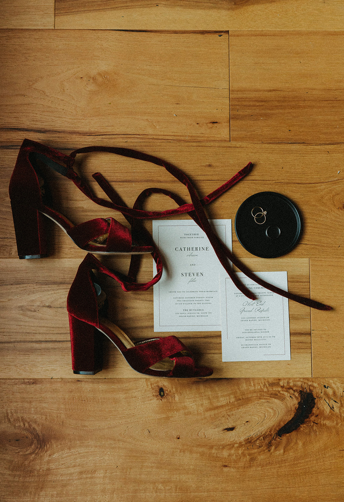 Downtown Grand Rapids Wedding Details in a layflat photograph with red velvet heels.
