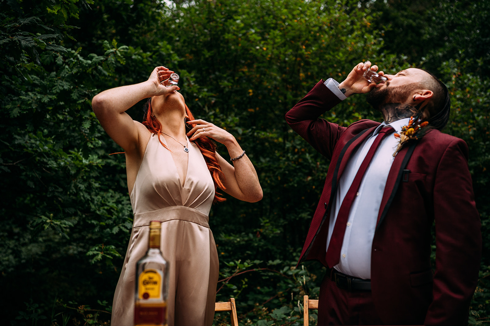 Bride and Groom drink tequila to celebrate their marriage.