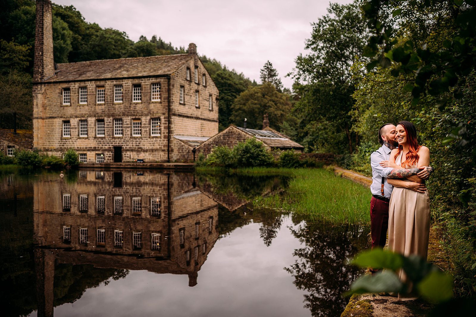 Couple portrait by the water in front of the mill