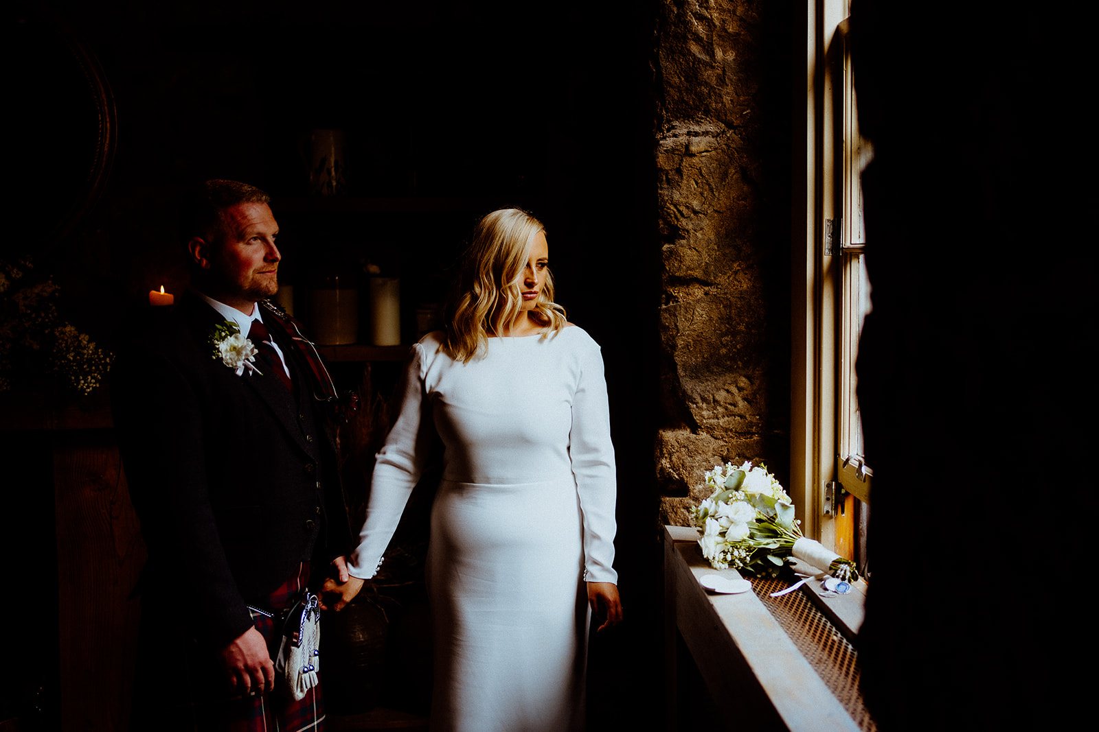 Bride & Groom standing next to window at The Bothy Glasgow