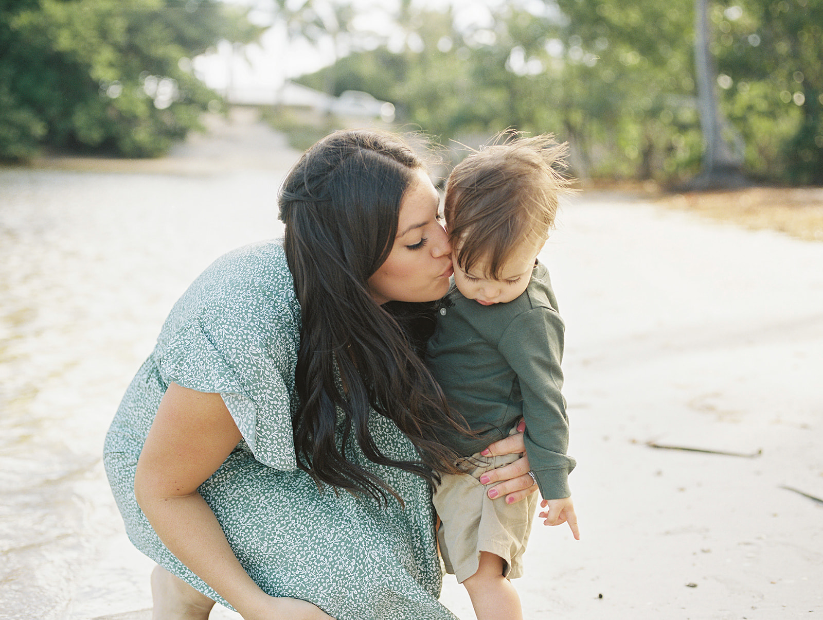 West Palm Beach Family photographer captures mom kissing little boy on cheek 