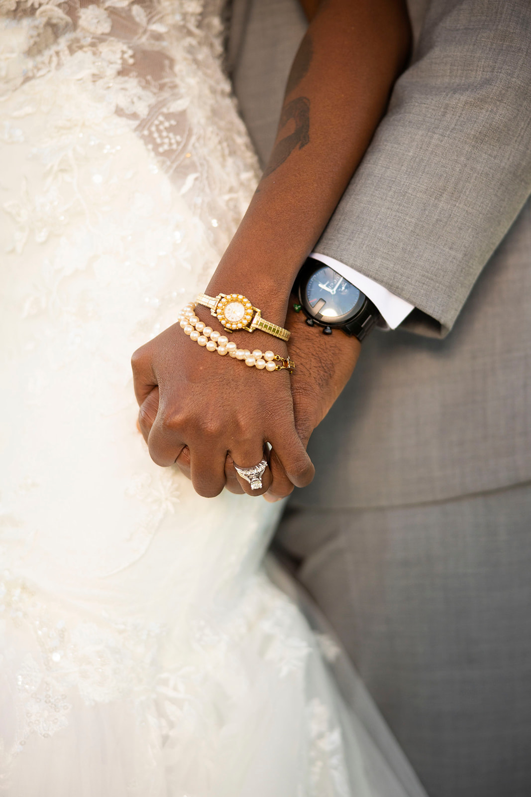 a close up of the couples hands and rings at their post wedding couples portrait session at the pavilion at haggin oaks