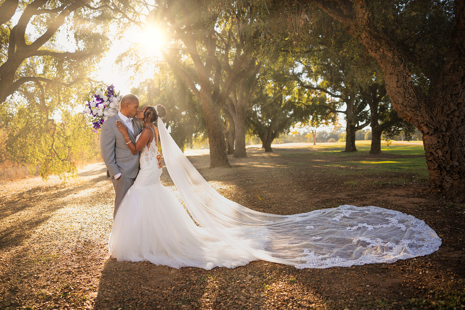 a couple who is posed for their post wedding couples portrait session at the pavilion at haggin oaks with sunlight