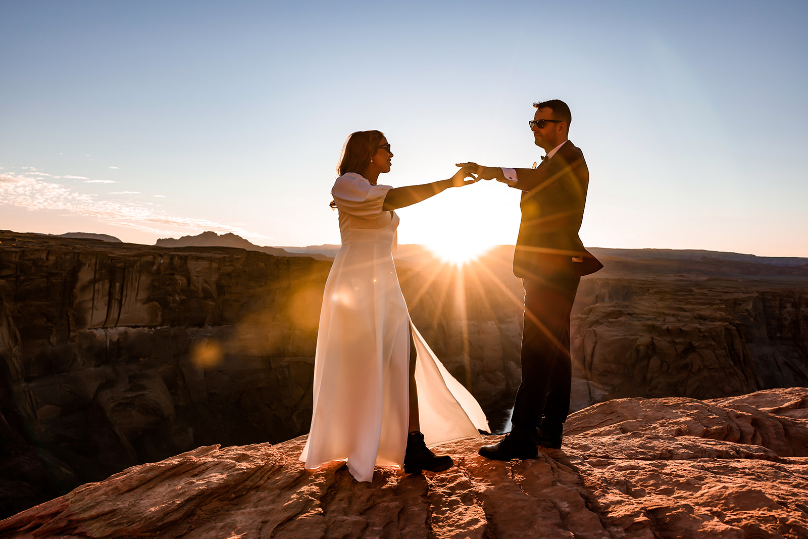 Dancing in the wind at sunset, Horseshoe Bend elopement wedding