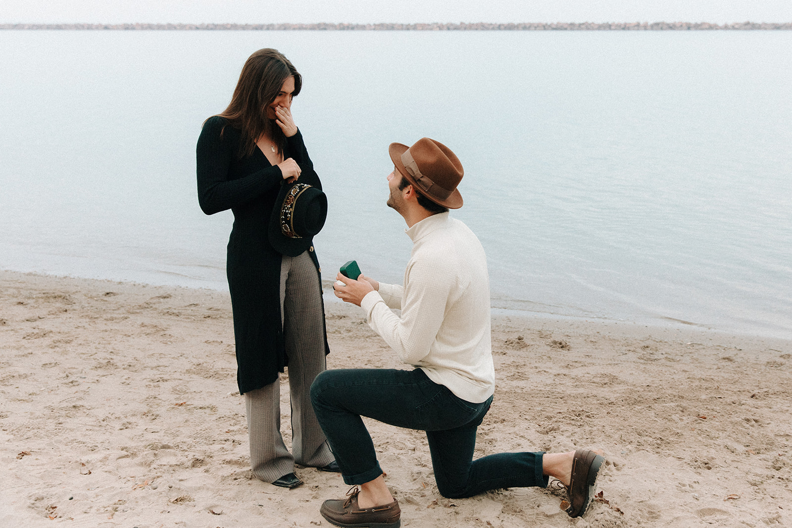 Man proposes in Bay View Park Milwaukee on the Lake Michigan Beach