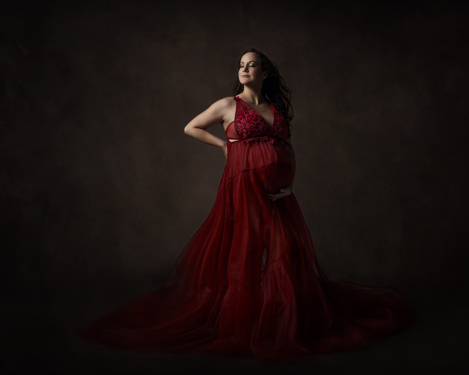 A custom maternity session with a glamor style