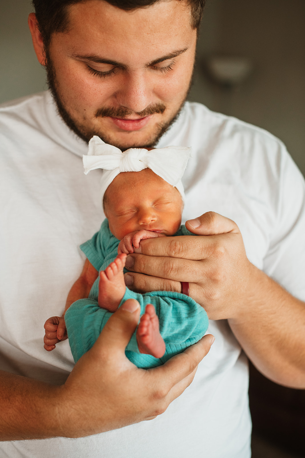 A father and newborn baby in Springfield MO