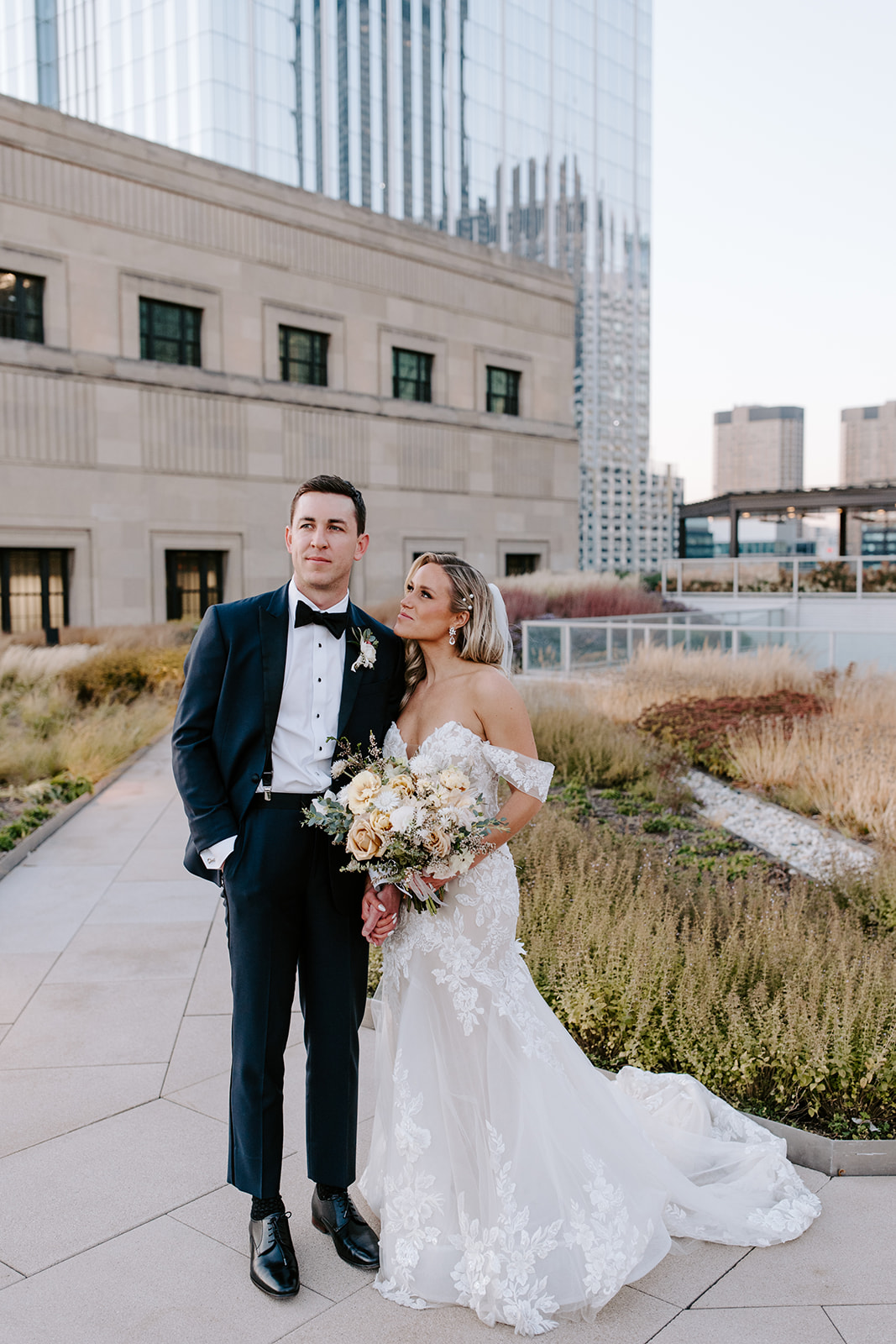 Couple shares intimate moments on a rooftop in downtown chicago for their October wedding 