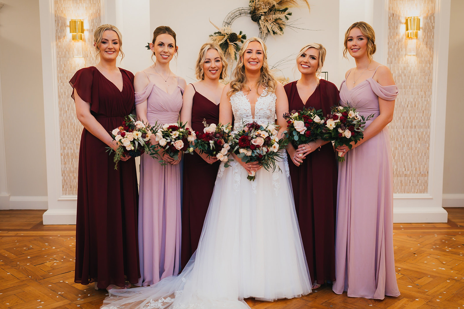 a group photograph of the bride and her bridesmaids