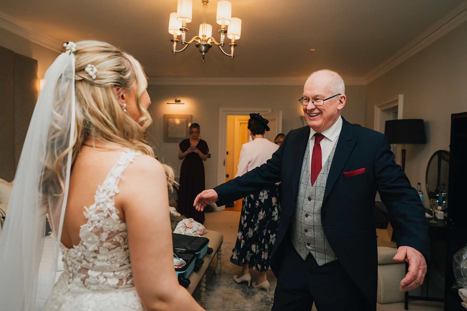 the father of the groom see's his daughter in her bridal gown for the first time