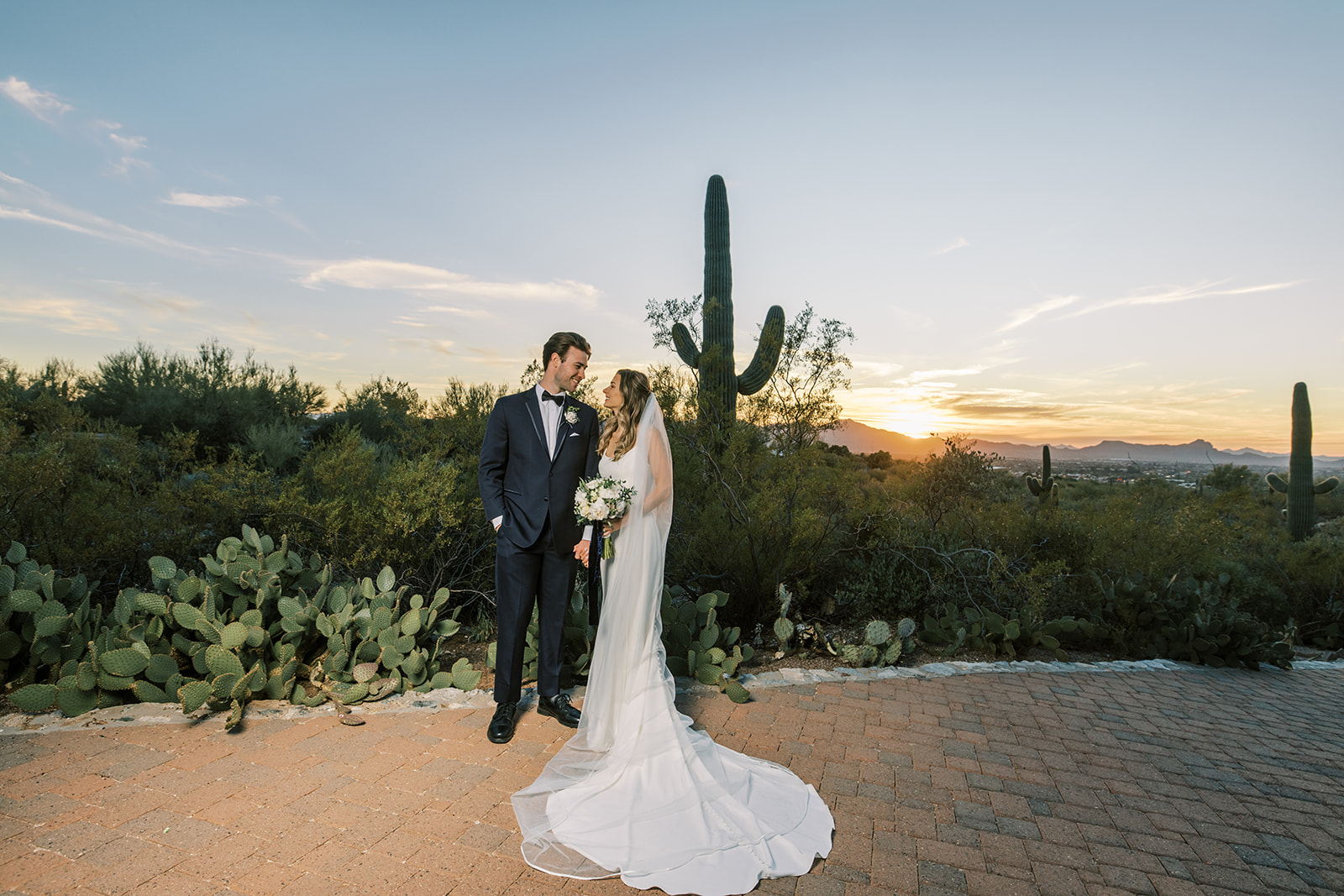 Bride and Groom with bouquet, wedding photography in Tucson, Arizona at sunset in Sonoran Desert