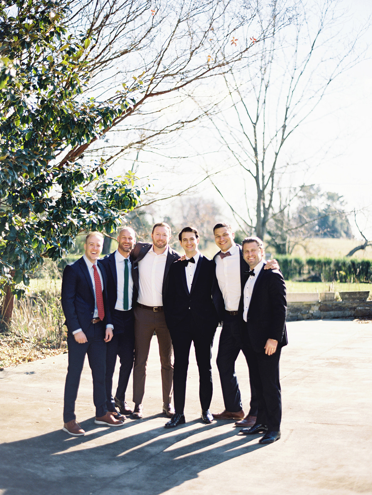 groomsmen pictures blue tux black tux black and white tux brown slacks elegant wedding pictures brown tie green tie