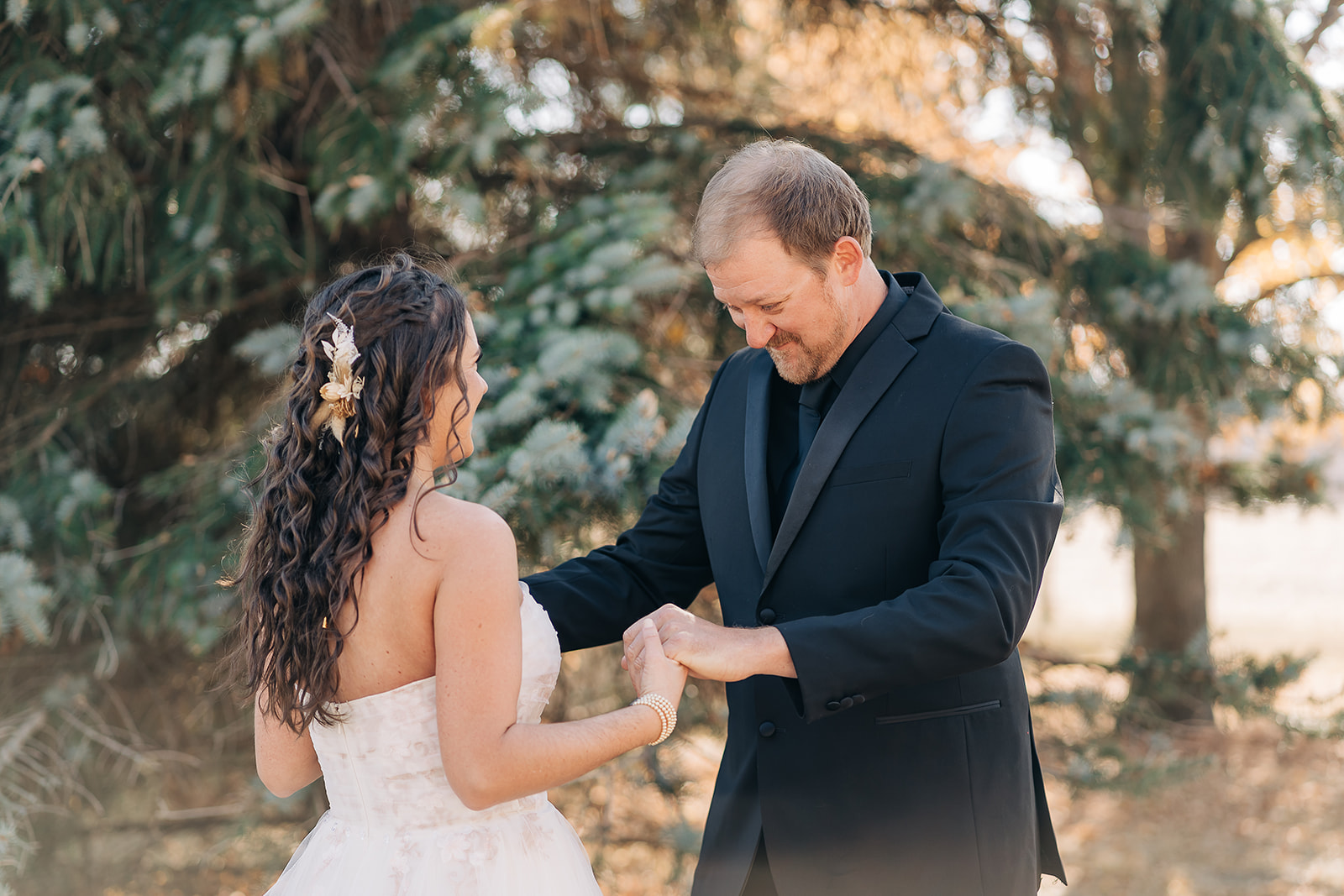 A bride and groom share their first look outdoors on their wedding day.
