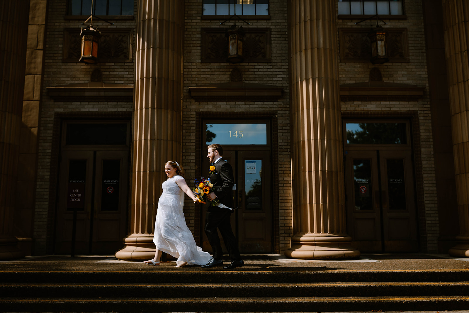 Running elopement couple at The Washington County Courthouse