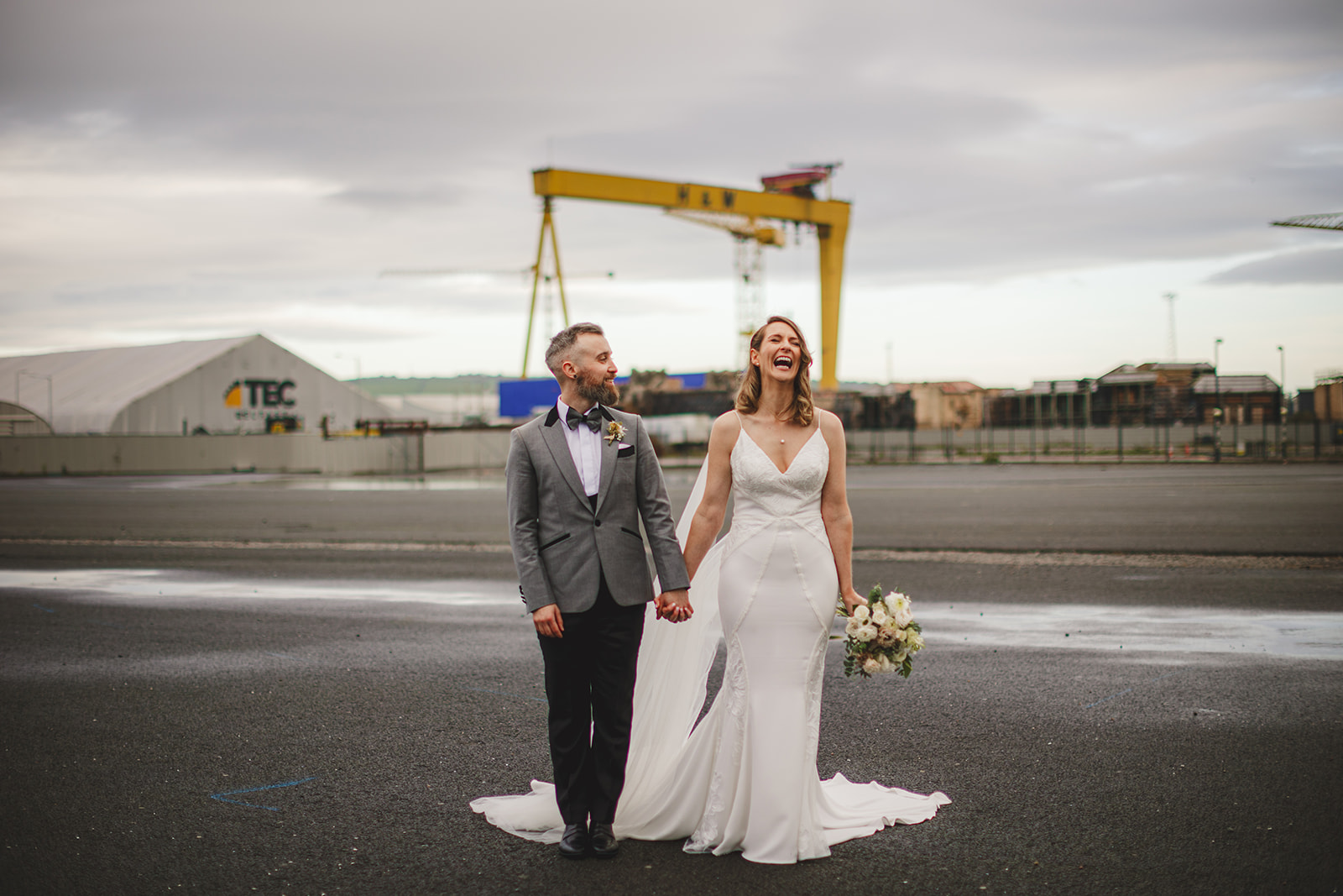Couple Portraits on their wedding day by iconic Harland & Wolff cranes at Titanic Hotel Belfast