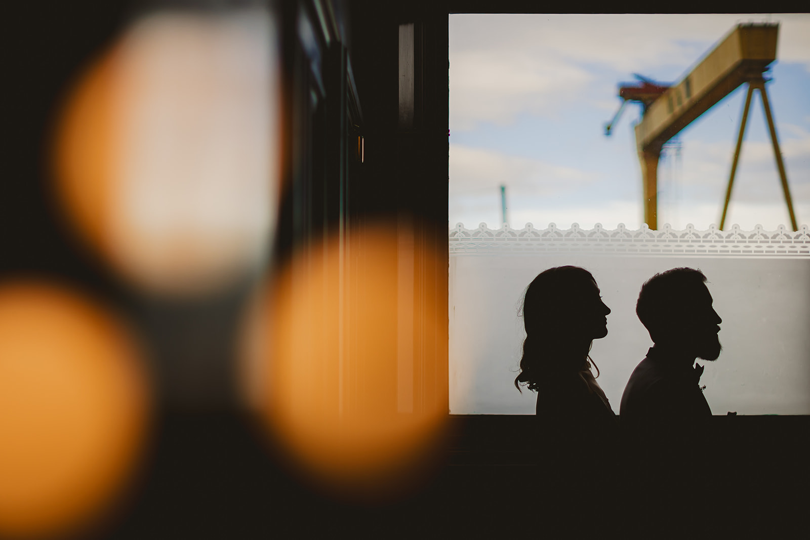 Silhouette shot of couple of their wedding day in front of Hardland and Wolff cranes Belfast City Centre