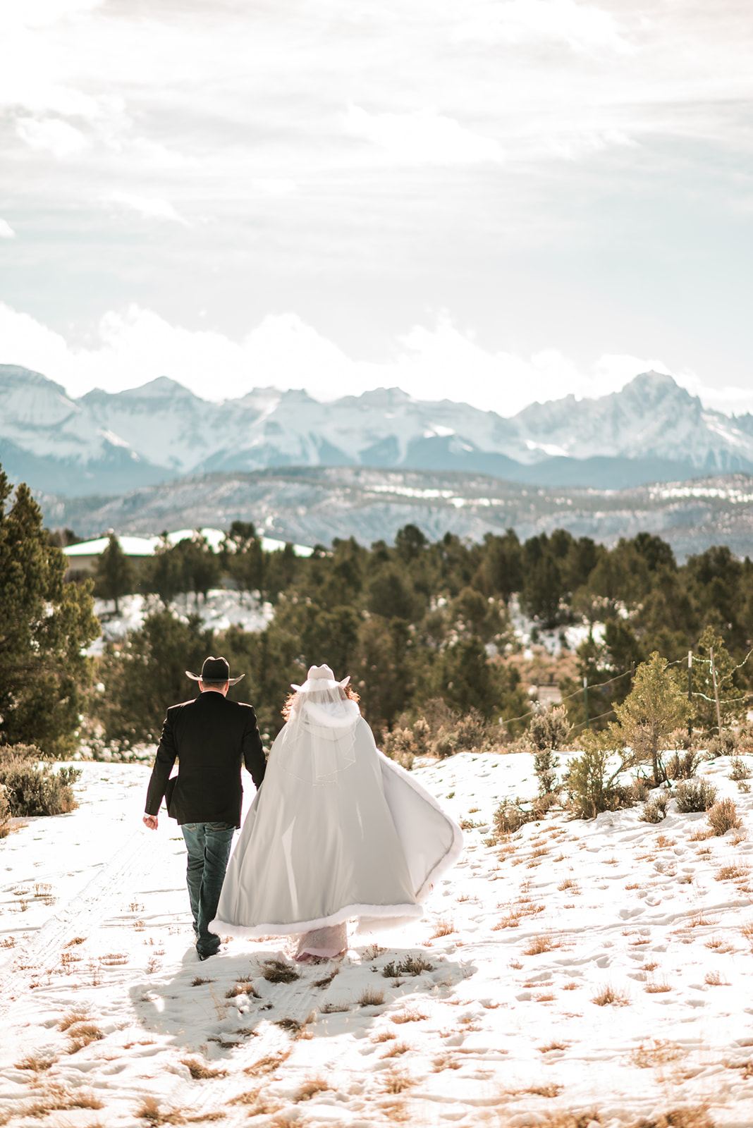 Day after wedding adventure session in the winter in Ridgway Colorado, with views of Mt. Sneffels