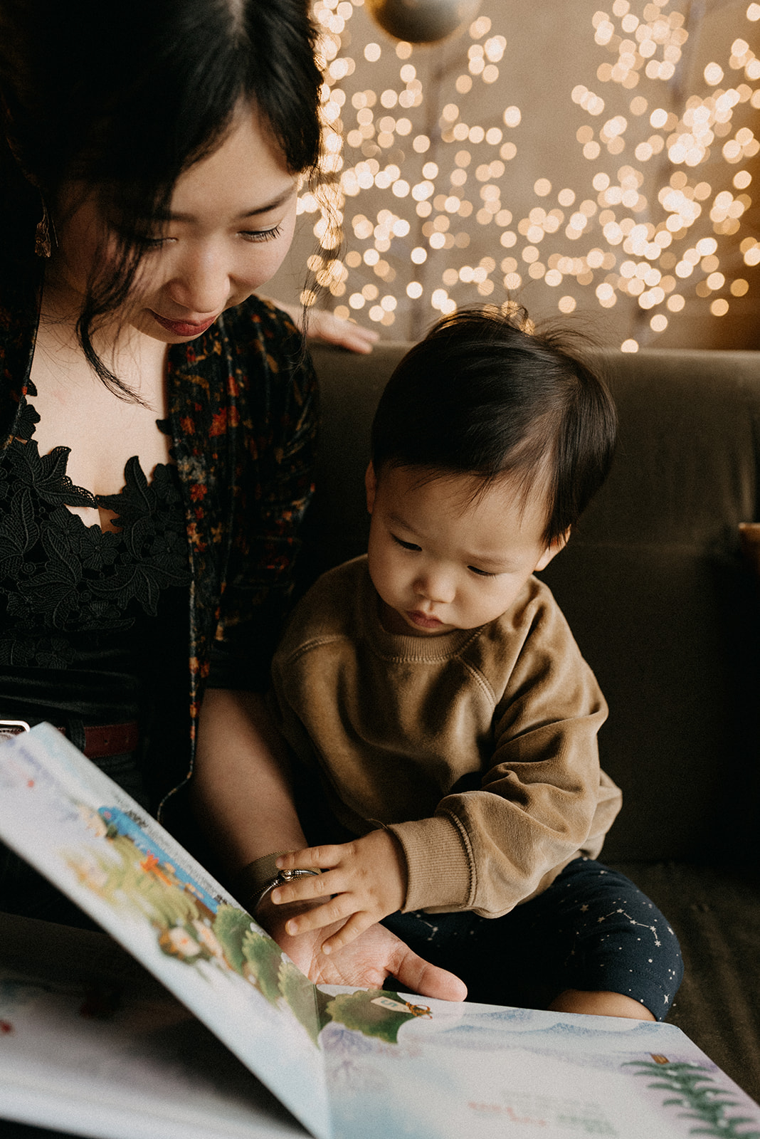 Mommy reading Christmas book for her son