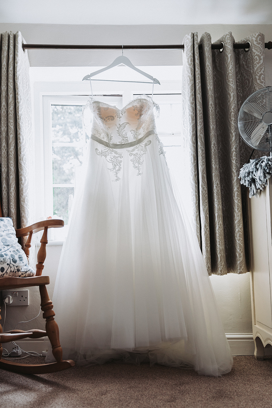 Wedding dress hanging in the brides room. Wedding Photo by Perfect Memories Photography