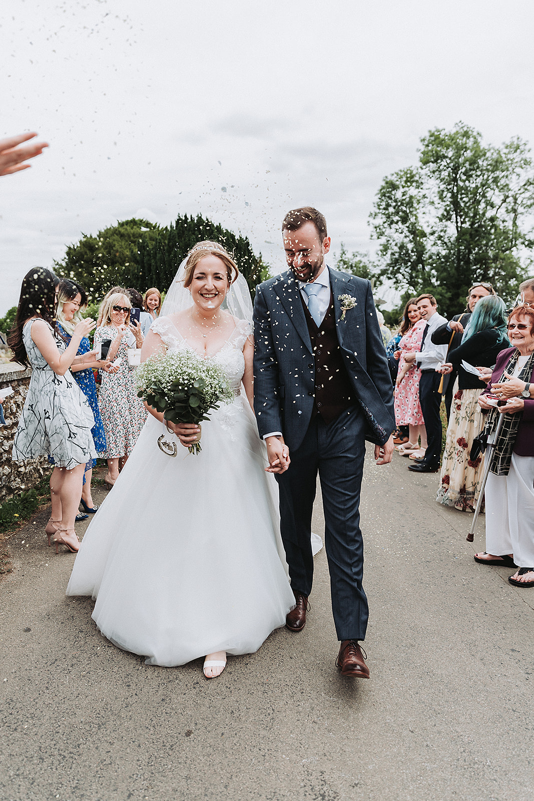 Bride and groom outside little gaddesden church confetti throw Wedding Photo by Perfect Memories Photography