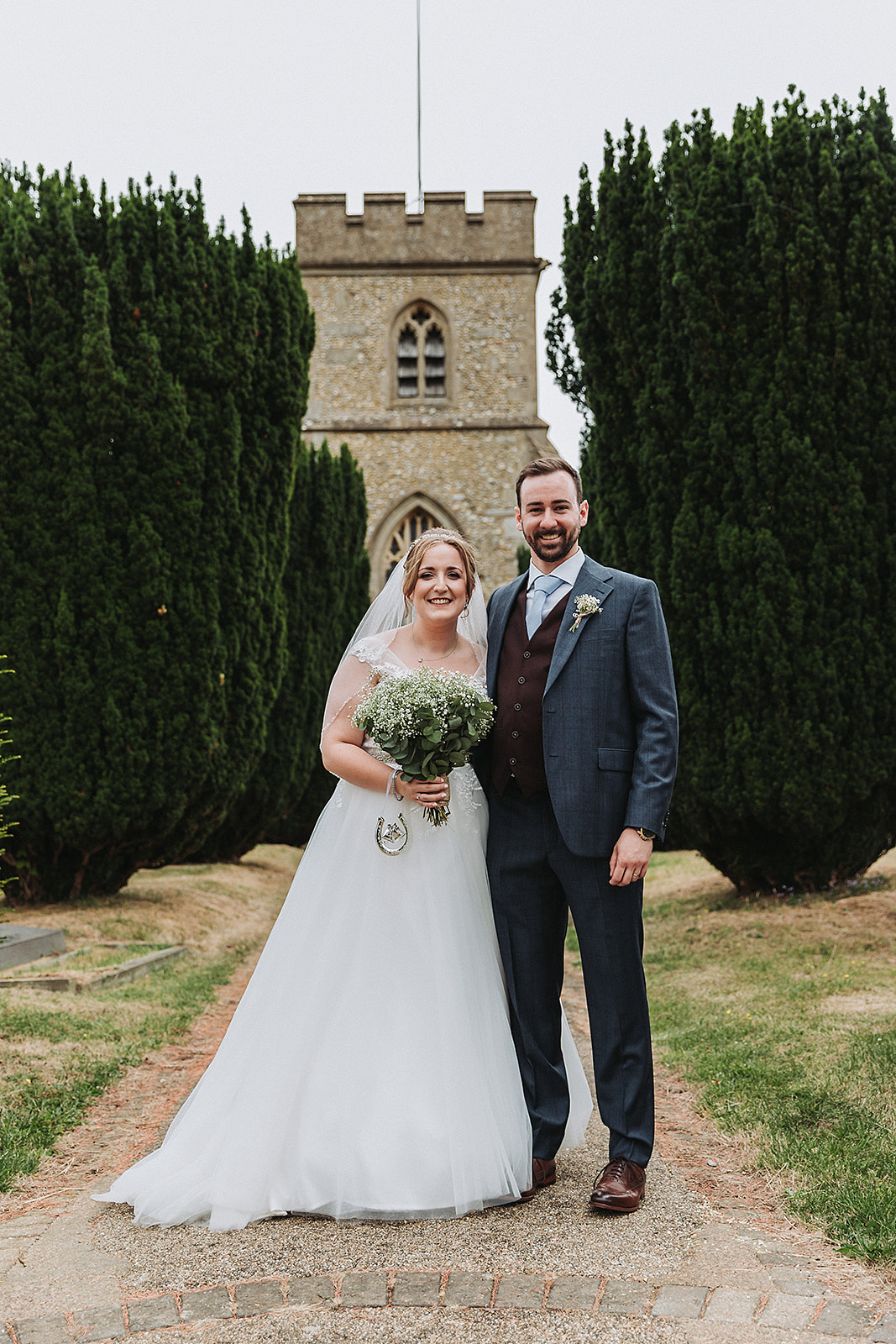 Bride and groom outside Little Gaddesden Church, Hertfordshire Wedding Photo by Perfect Memories Photography