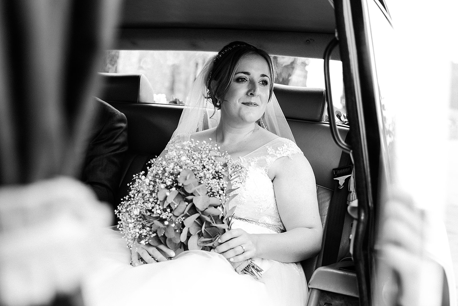 Bride sitting inside her car from Lord Cars London. Wedding photo by Perfect Memories Photography