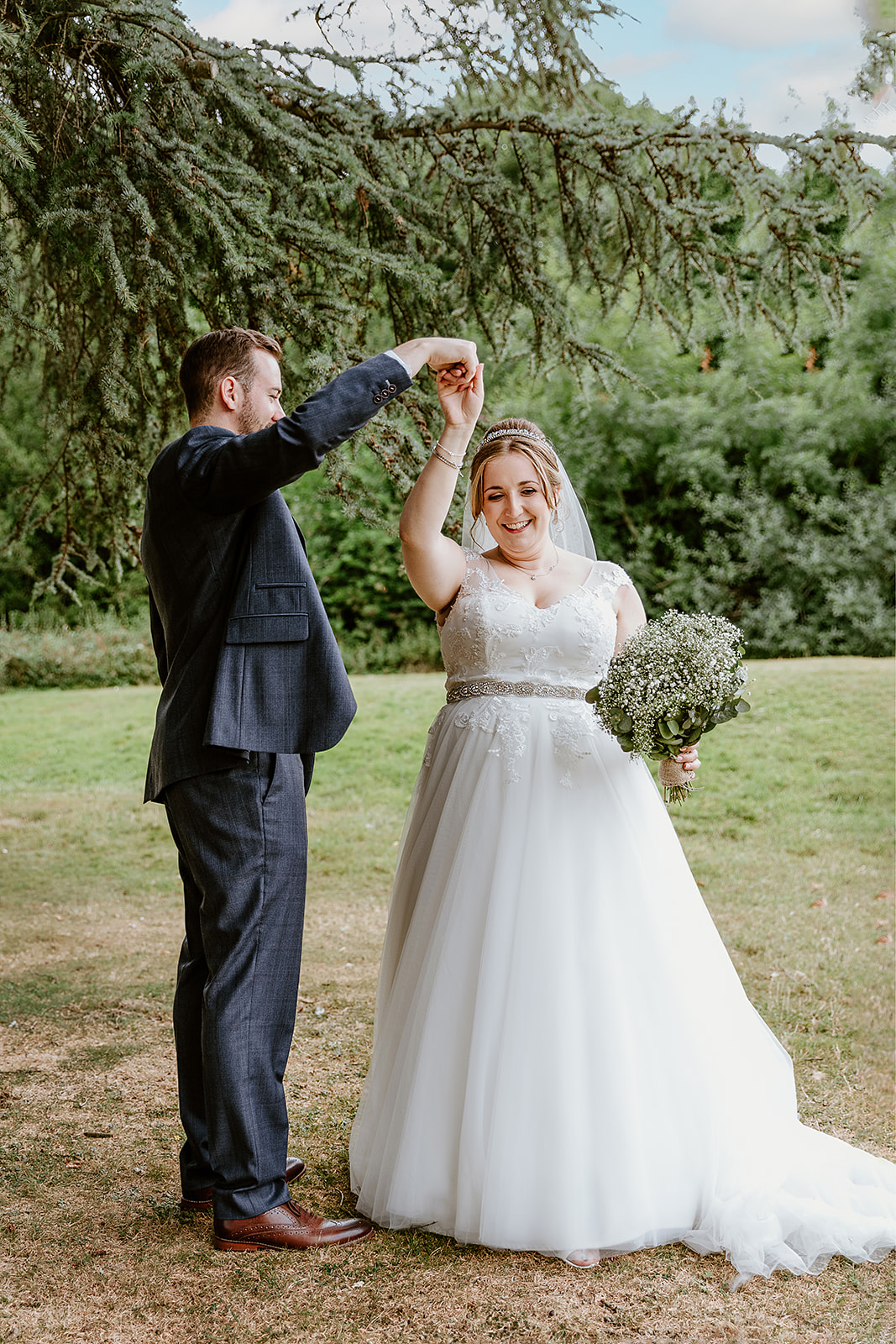 Bride and groom dancing outside at Pendley Manor, Tring. Wedding Photo by Perfect Memories photography