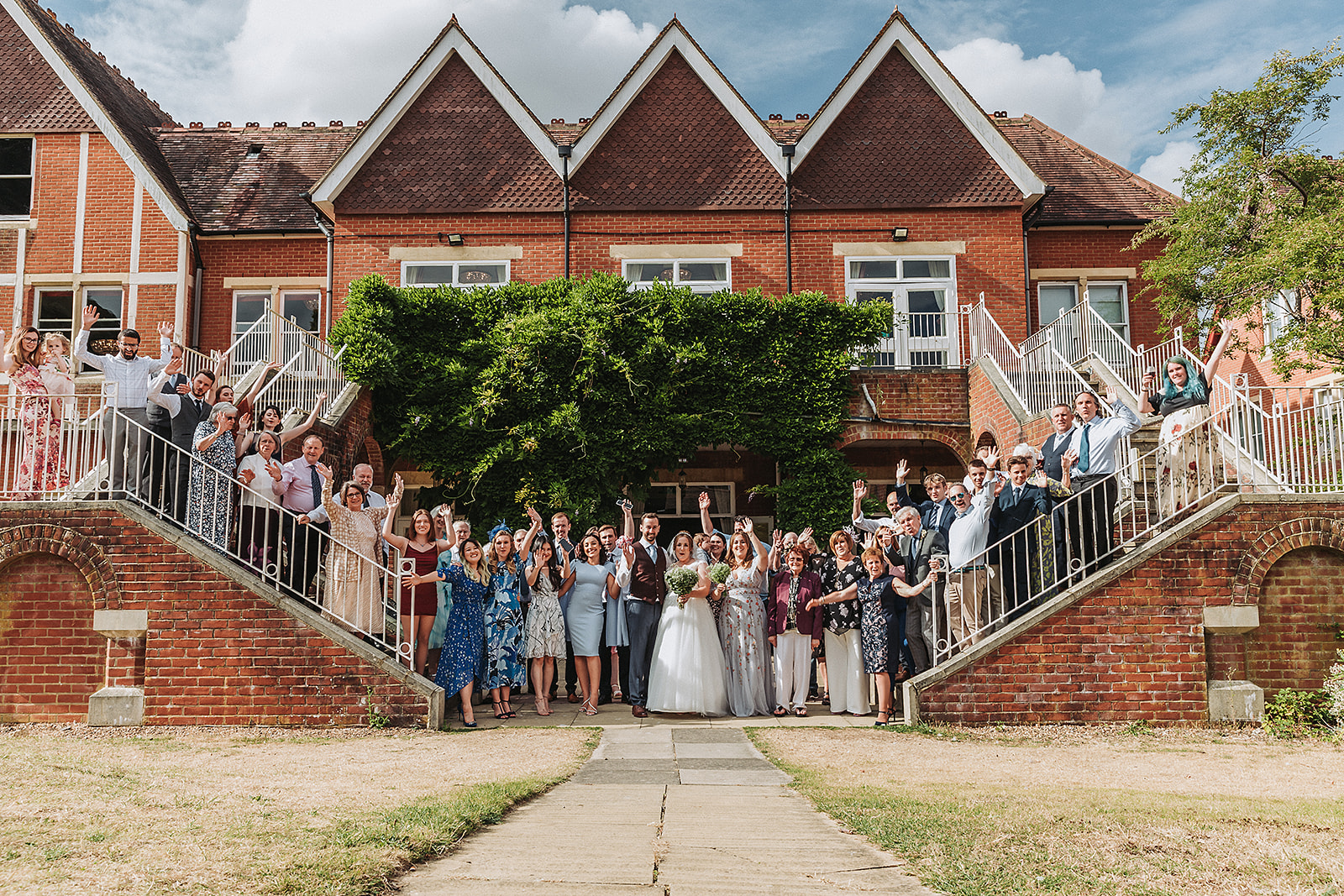 Family photo smiling at Pendley Manor, Tring. Wedding Photo by Perfect Memories photography