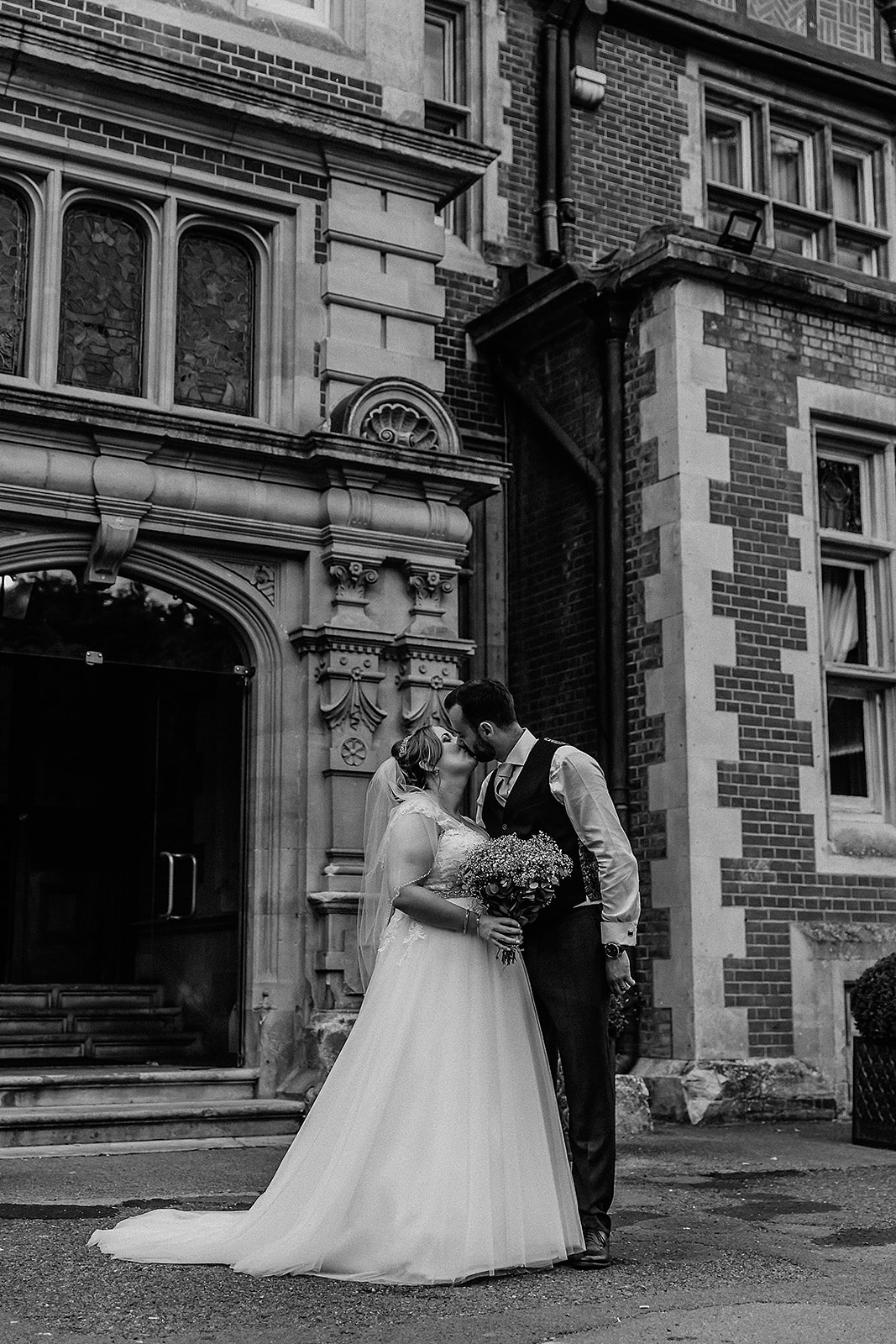Bride and groom kissing at Pendley Manor, Tring. Wedding Photo by Perfect Memories photography