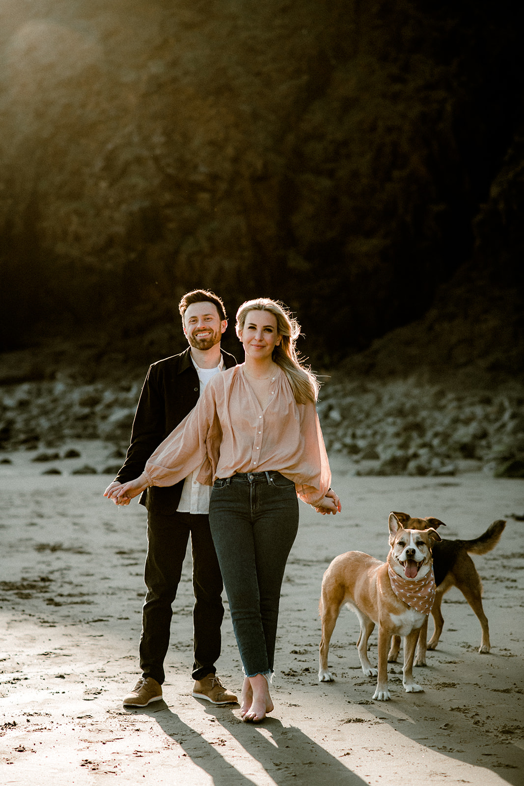 A couple and their dogs at Indian Beach at their Northern Oregon Coastal Engagement