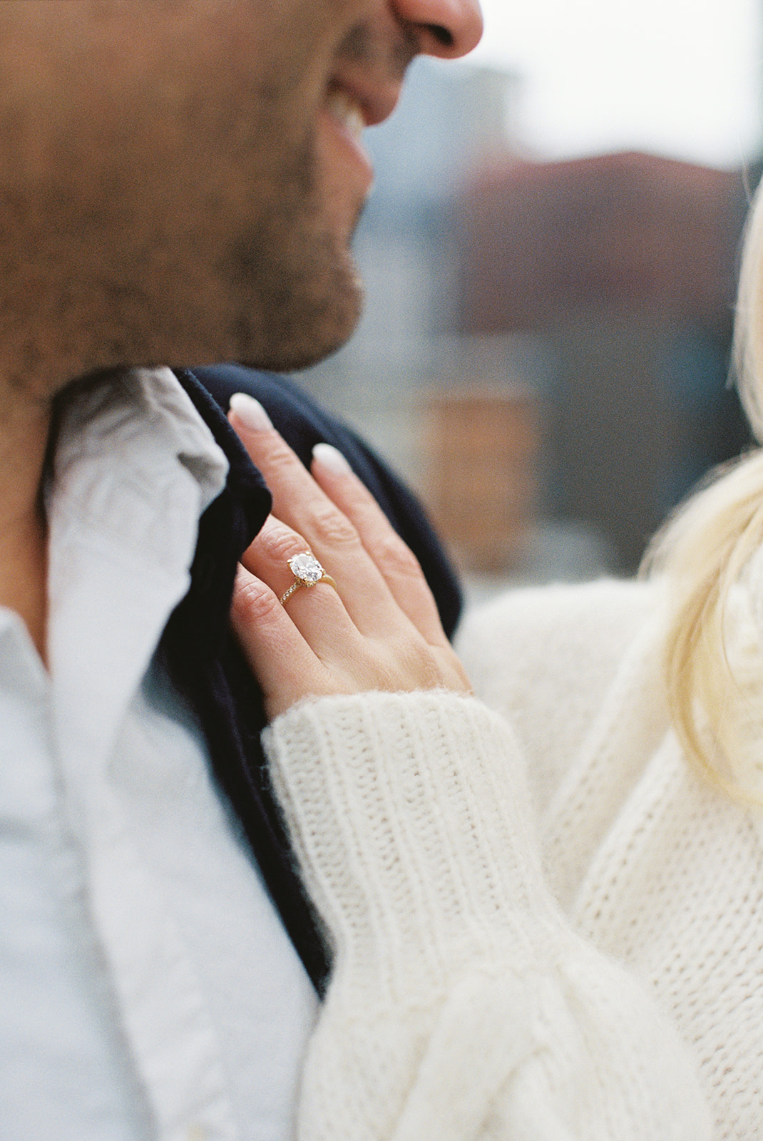 close on diamond engagement ring during city engagement session