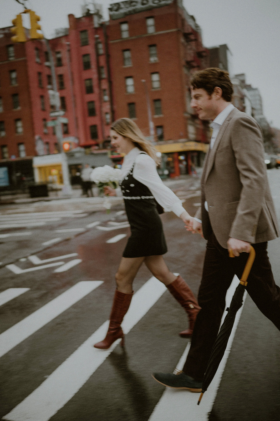 woman and man crossing the street in downtown nyc