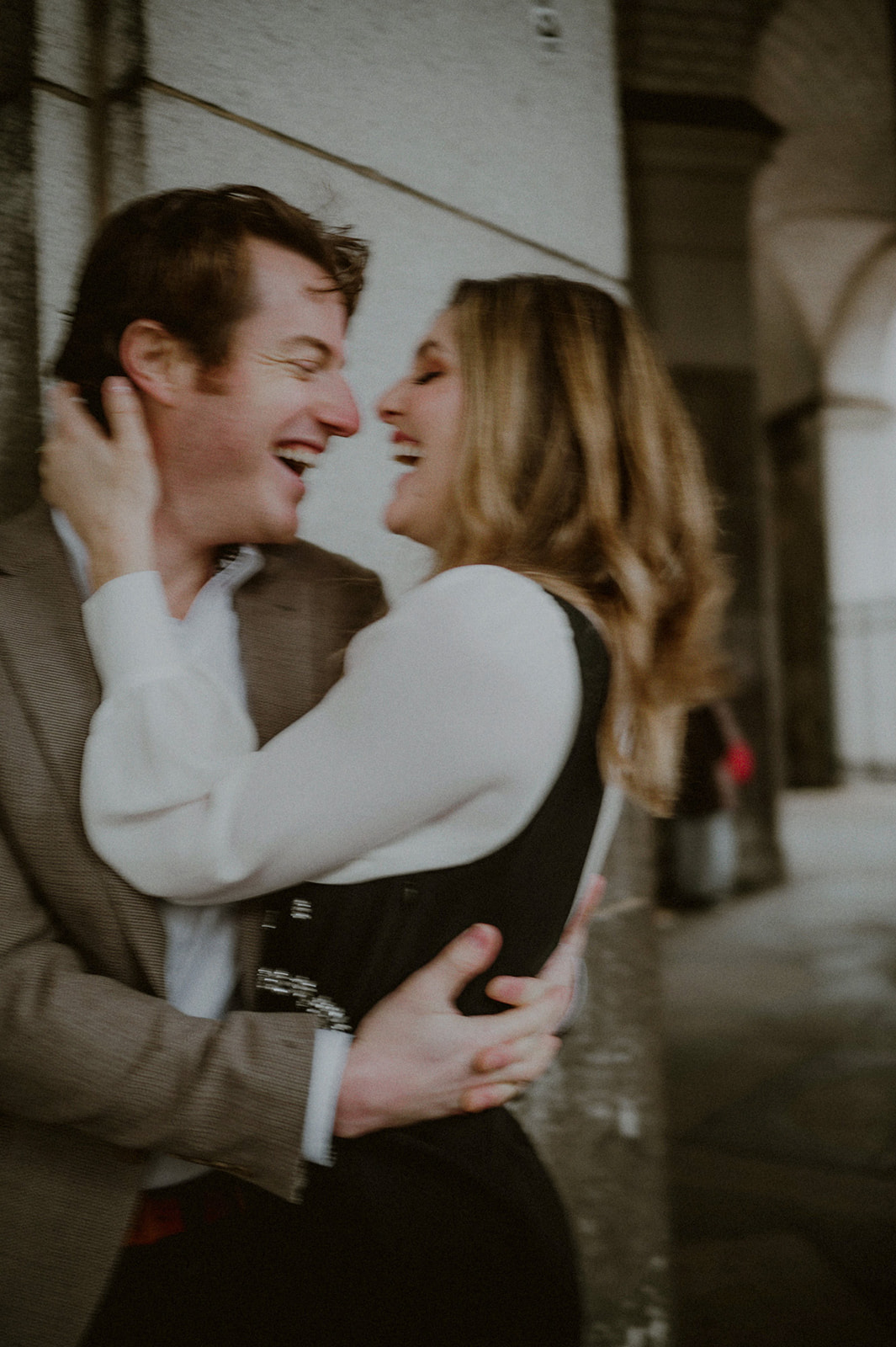 couple embraced and candidly laughing together for their nyc elopement photos