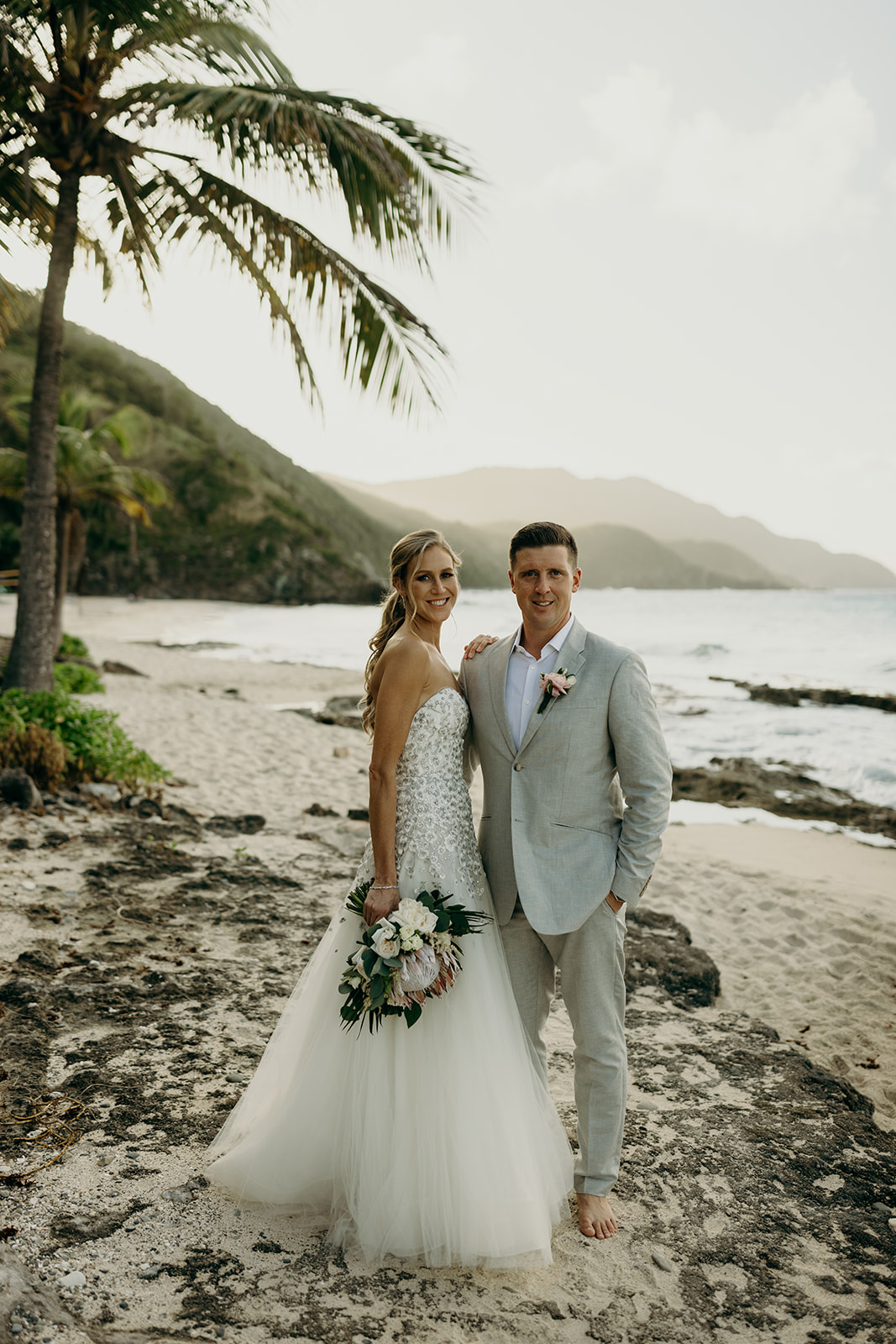 Couple during beach destination elopement at Carambola Beach Resort on St. Croix