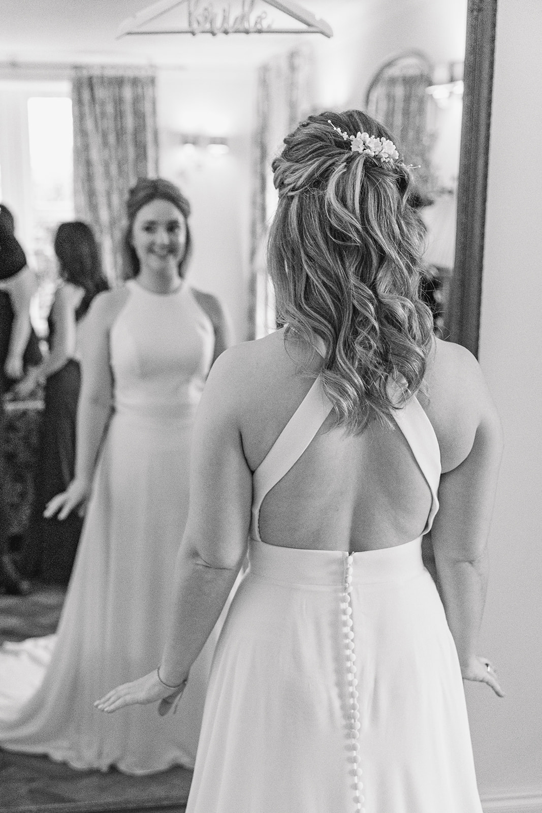 bride looking at herself in the mirror- Cairns Farm Estate