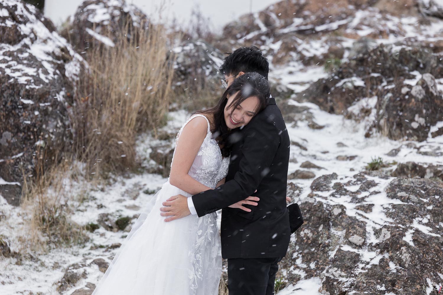 A portrait with the bride and groom on the snow