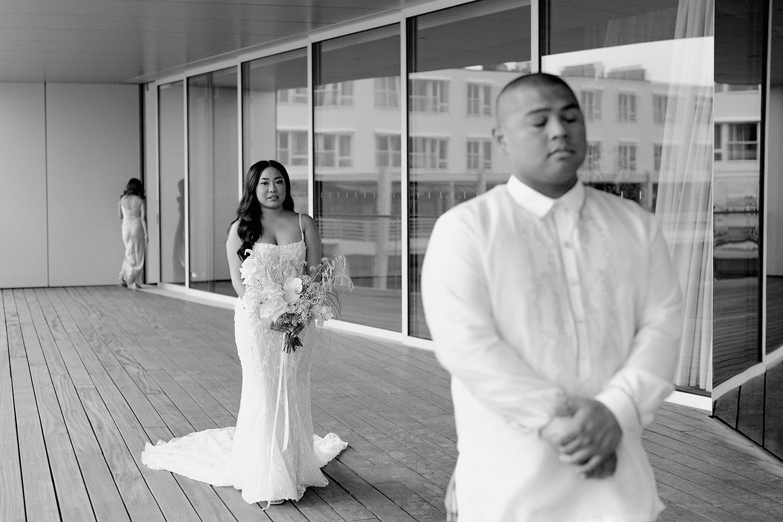 Vancouver wedding photographer captures photos of couple having their first look at Polygon Gallery