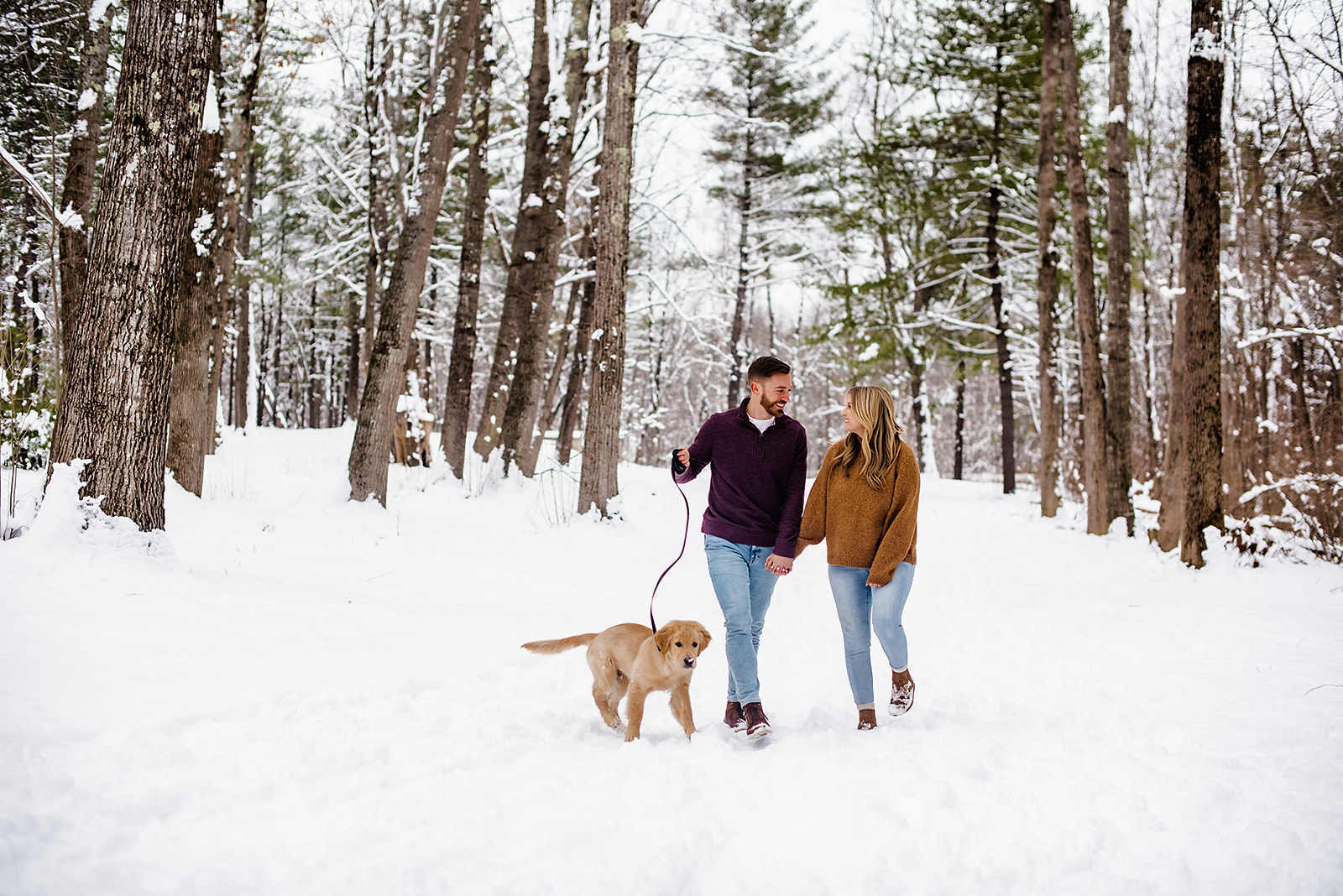 A couple with their new puppy in Maine. 