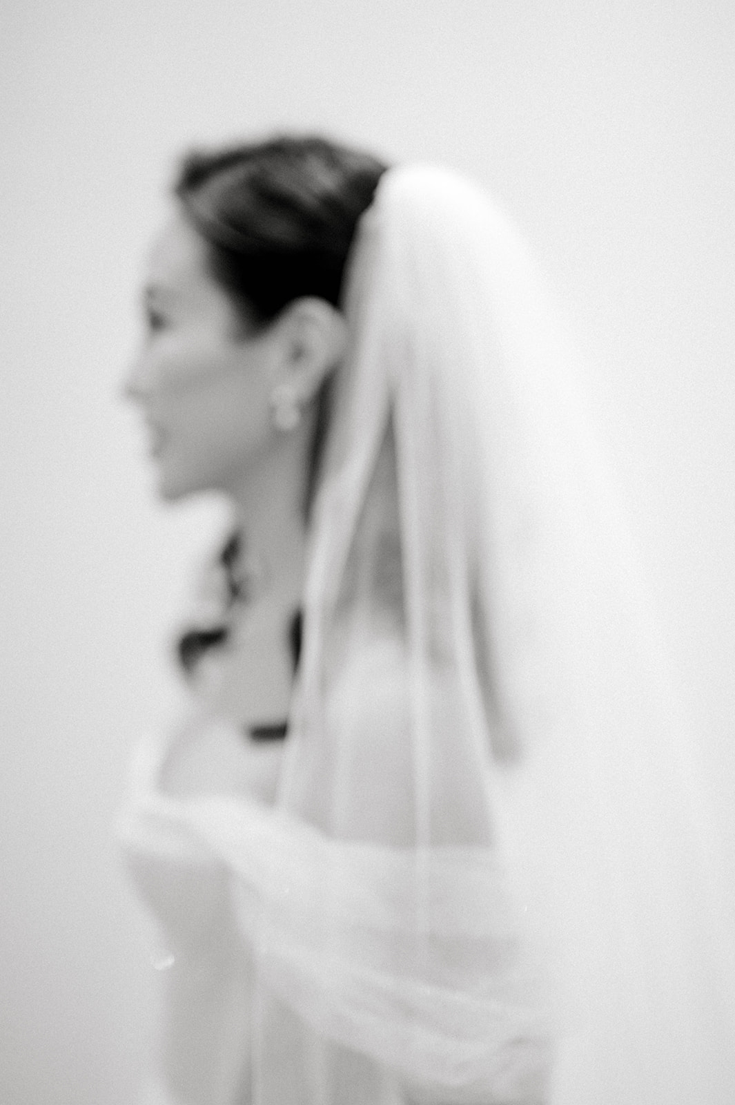 Timeless soft black and white photo of bride's profile at Classic Winter Wedding at Philadelphia's Historic Union Trust