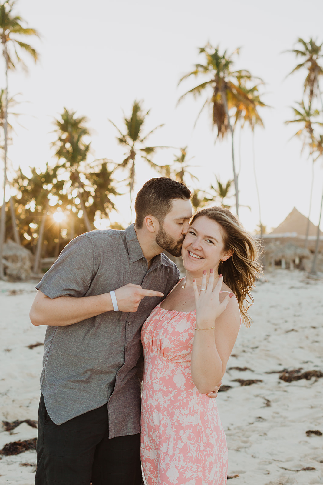 A freshly engaged couple on the beach at sunset in Punta Cana Dominican Republic