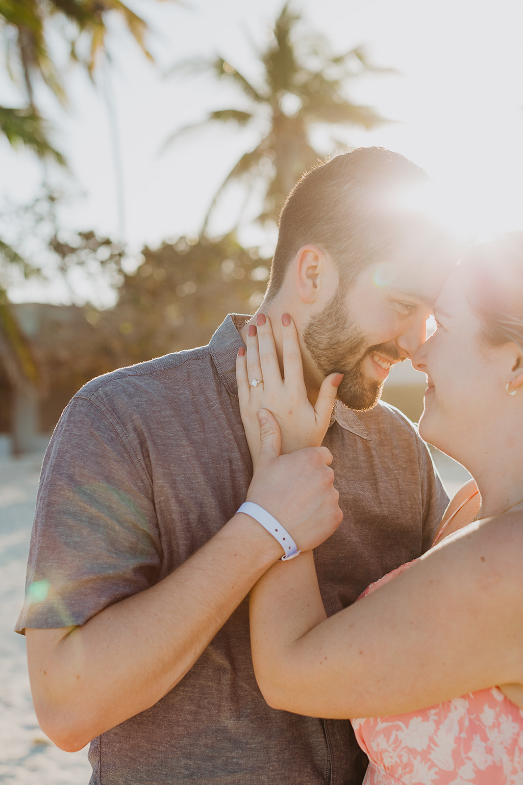 sunset light filtering through the trees on the beach in Punta Cana moments after he proposed