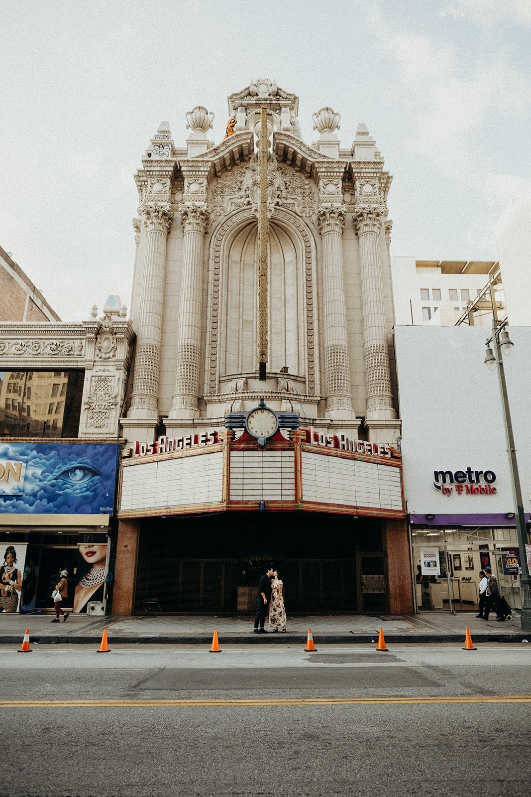 couple standing in front of Los Angeles theatre