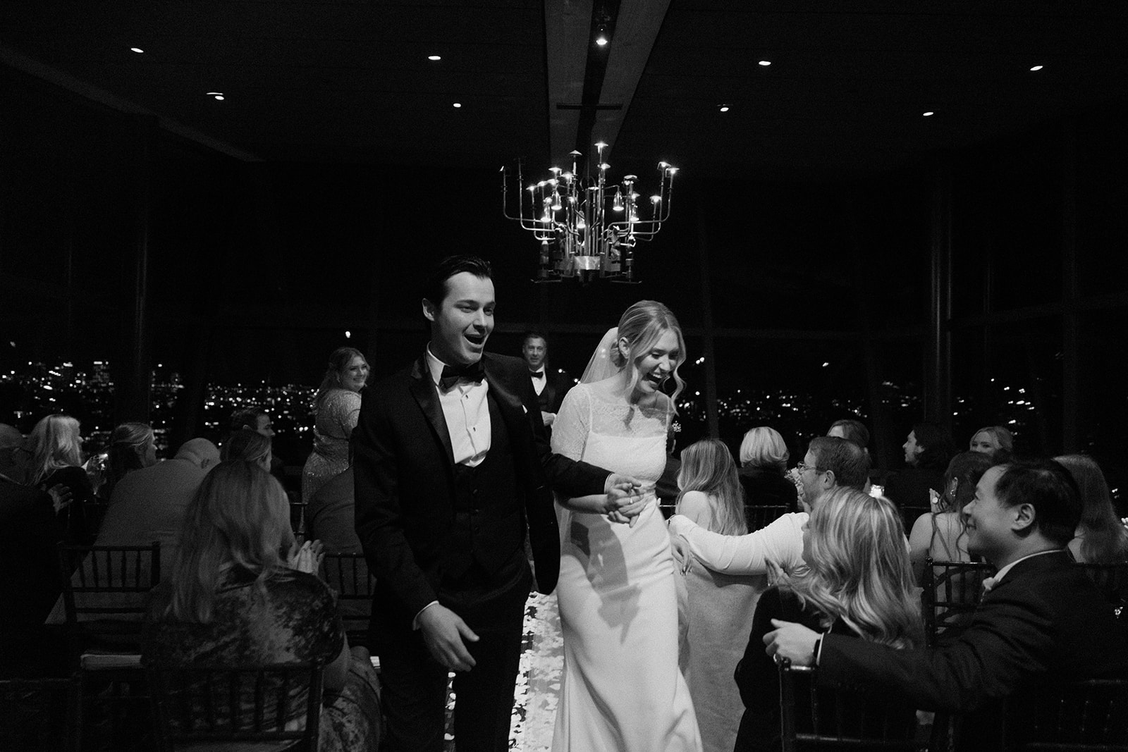 bride and groom walk back up aisle during Canlis wedding